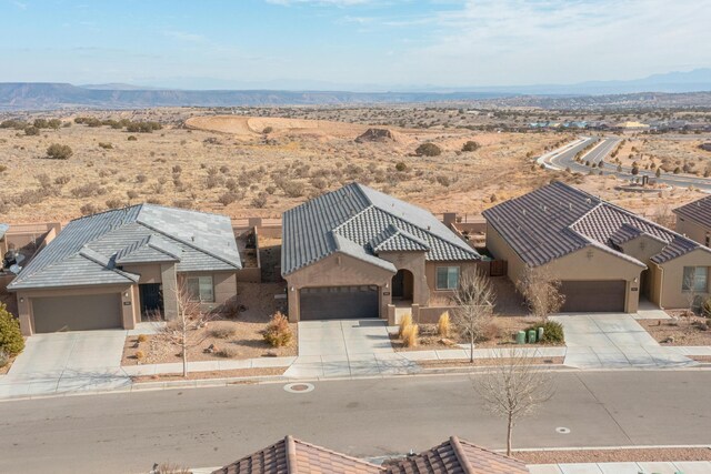 view of front of house with a garage and a mountain view