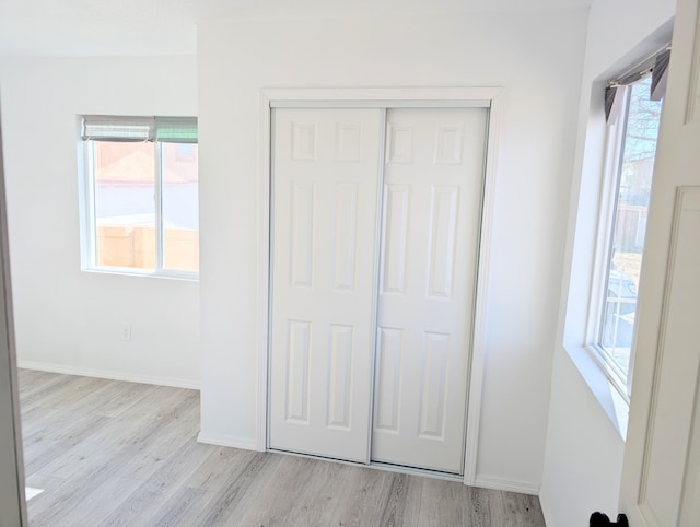 140 65th St NW, Albuquerque, NM 87105 - unfurnished bedroom featuring light wood finished floors, a closet, and baseboards