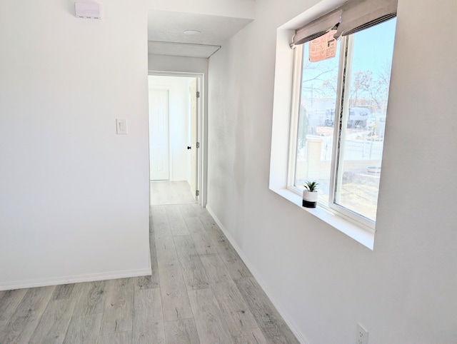 140 65th St NW, Albuquerque, NM 87105 - hallway featuring light wood finished floors and baseboards