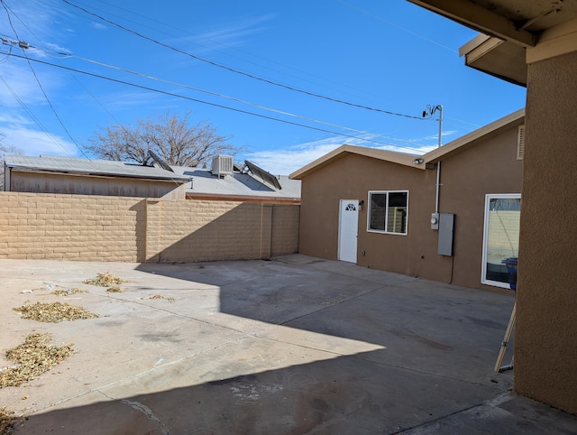 view of patio / terrace with fence and central AC