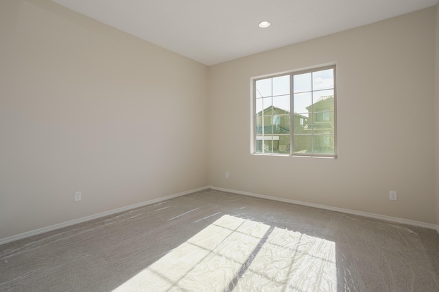 empty room featuring light colored carpet