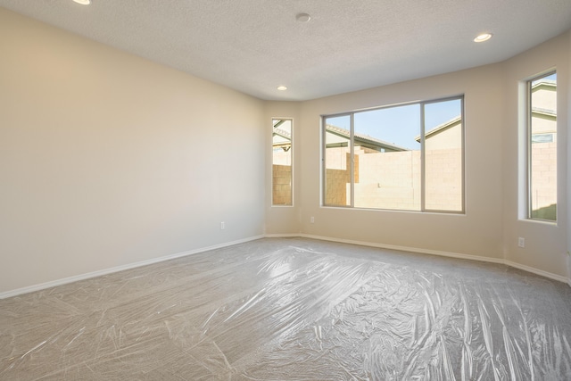 empty room with a textured ceiling