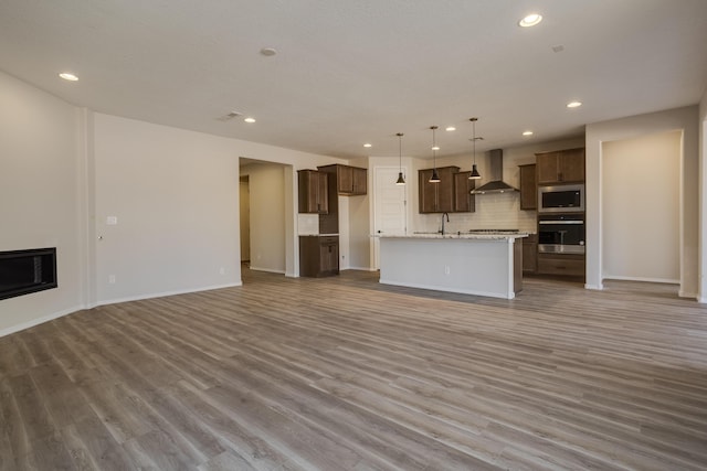 unfurnished living room with light hardwood / wood-style floors