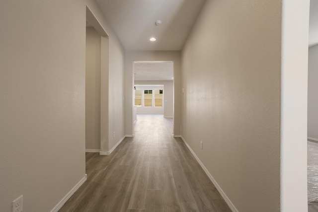 corridor featuring hardwood / wood-style flooring