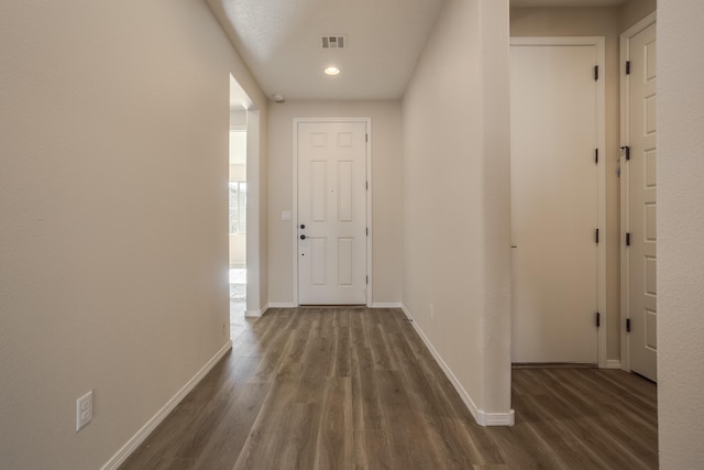 hallway featuring dark hardwood / wood-style flooring