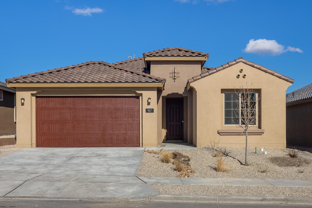 mediterranean / spanish-style house featuring a garage