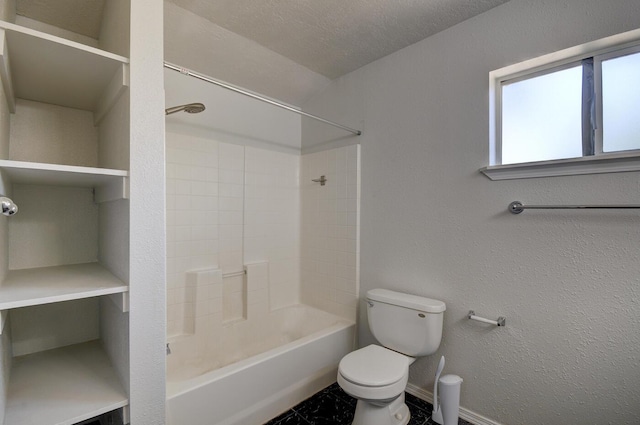 bathroom featuring  shower combination, a textured ceiling, and toilet