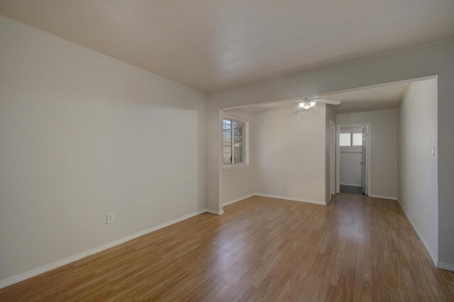 spare room with ceiling fan and light hardwood / wood-style flooring