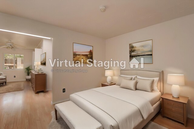 bedroom with light hardwood / wood-style flooring and ceiling fan