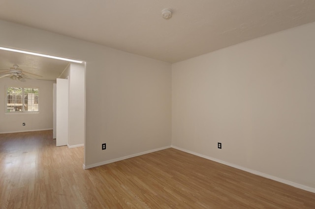 empty room with light wood-type flooring and ceiling fan