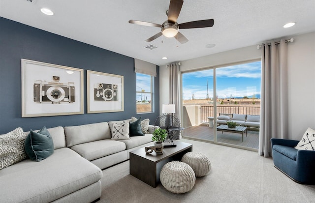 living room featuring ceiling fan