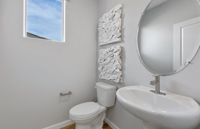 bathroom with toilet and sink