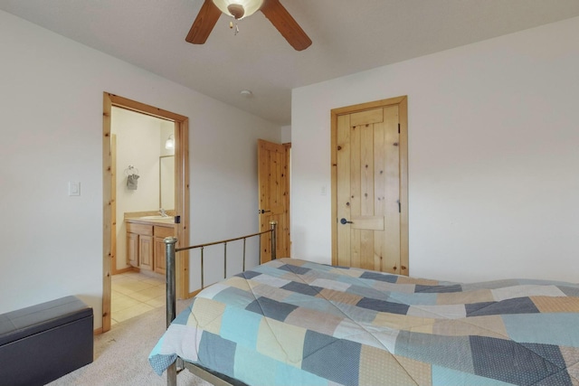 carpeted bedroom with connected bathroom and ceiling fan