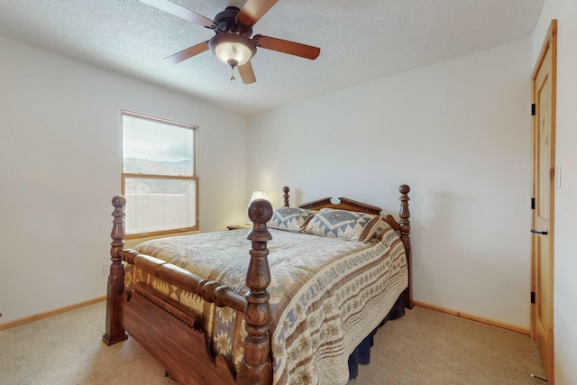 bedroom with ceiling fan and light colored carpet