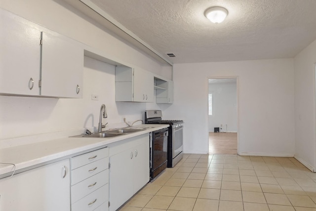 kitchen with sink, stainless steel gas stove, a textured ceiling, black dishwasher, and white cabinetry