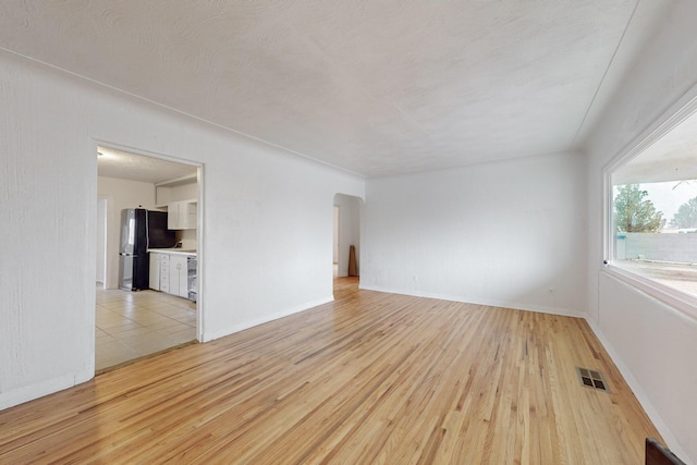 unfurnished room featuring light hardwood / wood-style flooring