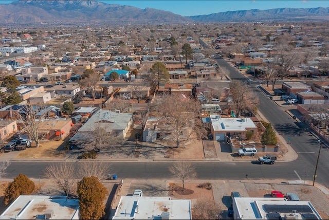 birds eye view of property with a mountain view