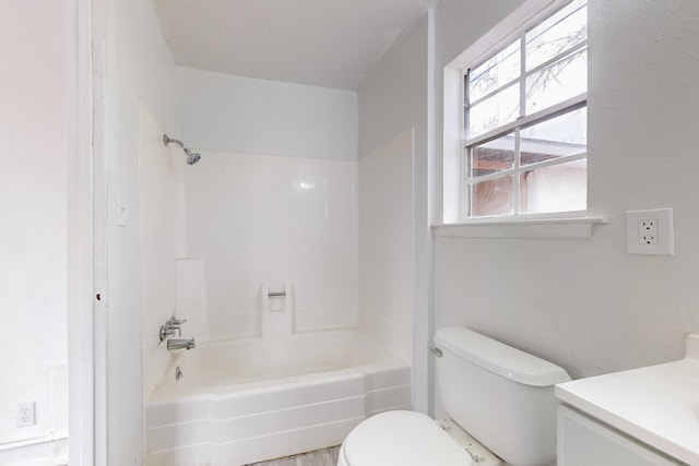 full bathroom with bathtub / shower combination, hardwood / wood-style floors, vanity, and toilet