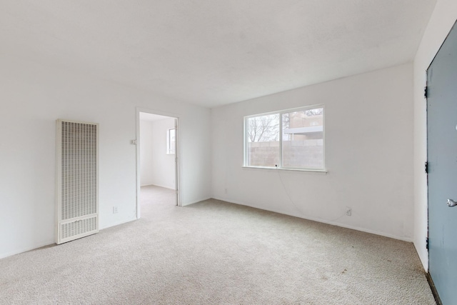 empty room with light colored carpet