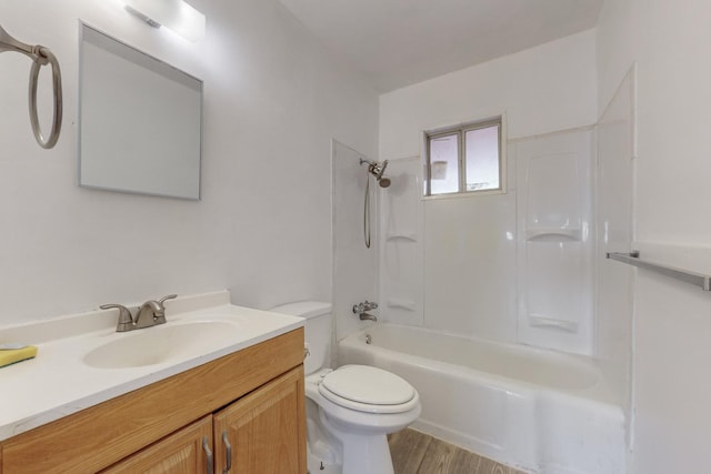 full bathroom featuring shower / tub combination, hardwood / wood-style flooring, vanity, and toilet