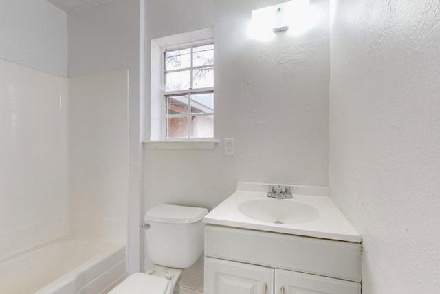 full bathroom featuring shower / bathing tub combination, vanity, and toilet