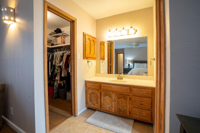 bathroom with tile patterned floors, ceiling fan, and vanity