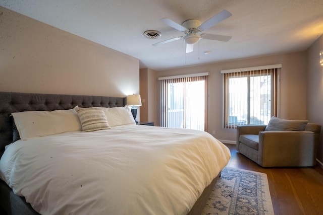 bedroom featuring hardwood / wood-style floors and ceiling fan