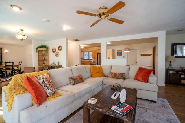 living room featuring ceiling fan and wood-type flooring