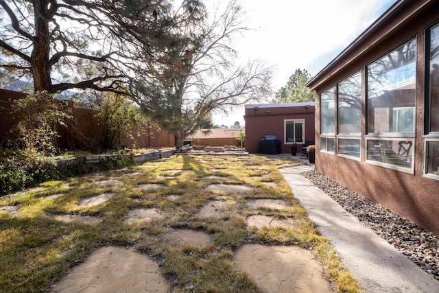 view of yard with a sunroom