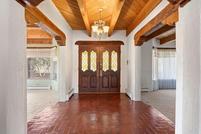 foyer featuring a notable chandelier and a baseboard radiator