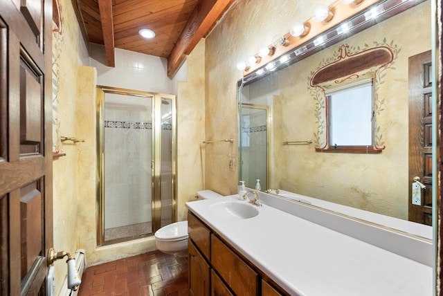 bathroom with vanity, toilet, and a shower with shower door