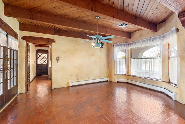 spare room featuring beam ceiling, french doors, and a baseboard heating unit