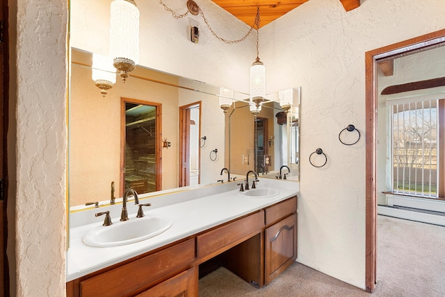 bathroom with vanity, wooden ceiling, and a baseboard heating unit