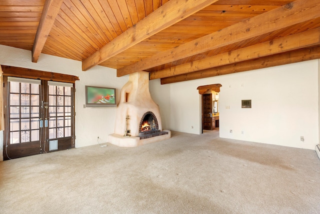 unfurnished living room featuring french doors, carpet, wood ceiling, and beamed ceiling