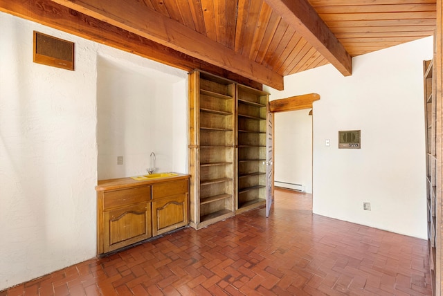 unfurnished living room featuring beam ceiling, a baseboard radiator, wooden ceiling, and sink