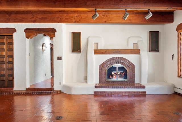 unfurnished living room featuring beam ceiling