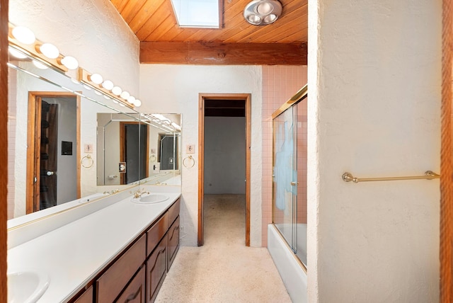 bathroom featuring shower / bath combination with glass door, beam ceiling, wood ceiling, and vanity