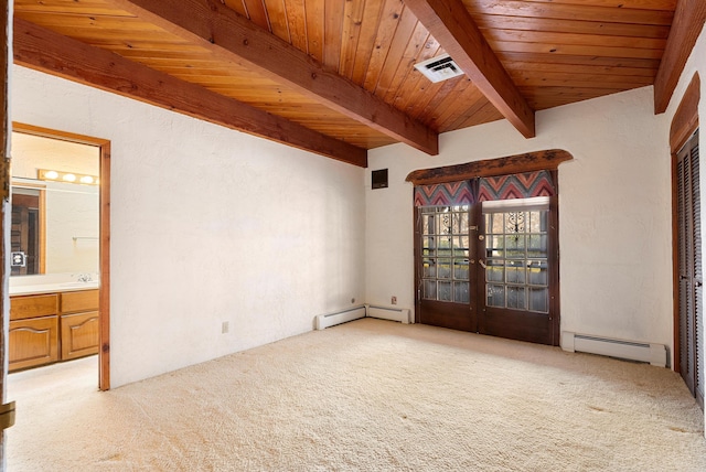 spare room featuring light carpet, french doors, baseboard heating, and wood ceiling