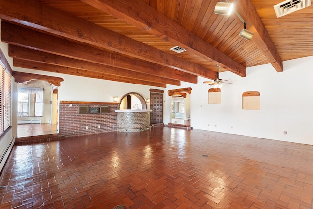 unfurnished living room with beam ceiling, ceiling fan, wood ceiling, and brick wall