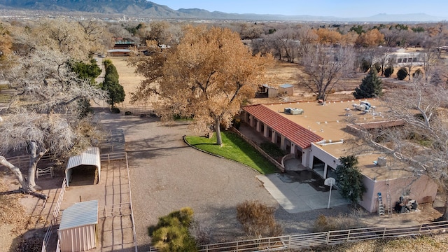 birds eye view of property featuring a mountain view