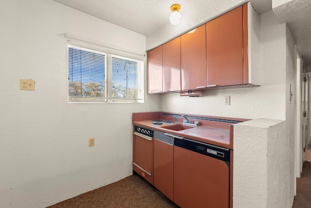 kitchen with dishwashing machine, dark carpet, and sink