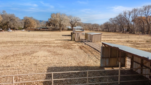 view of yard with a rural view