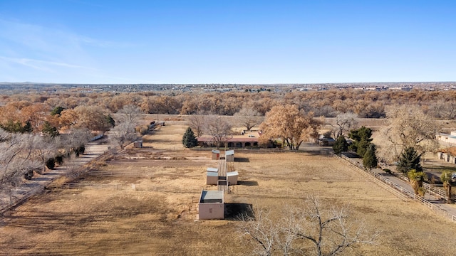 birds eye view of property featuring a rural view