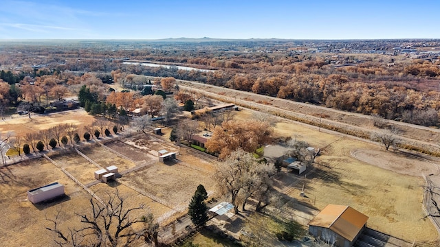 birds eye view of property with a rural view