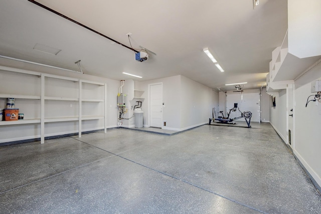 garage featuring a garage door opener and water heater