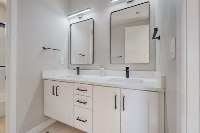 bathroom featuring tile patterned flooring and vanity