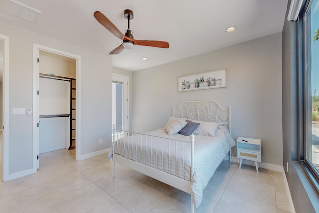 bedroom with light tile patterned floors and ceiling fan