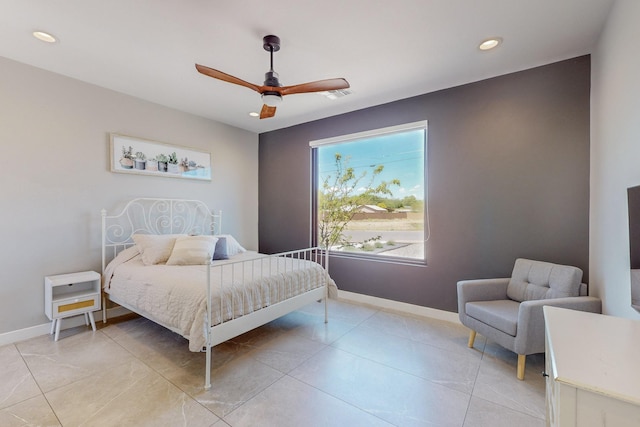 bedroom featuring multiple windows and ceiling fan