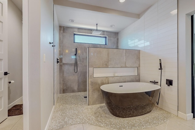 bathroom featuring tile patterned flooring, shower with separate bathtub, and tile walls