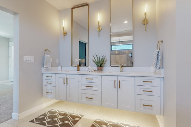 bathroom with tile patterned floors, a shower, and vanity